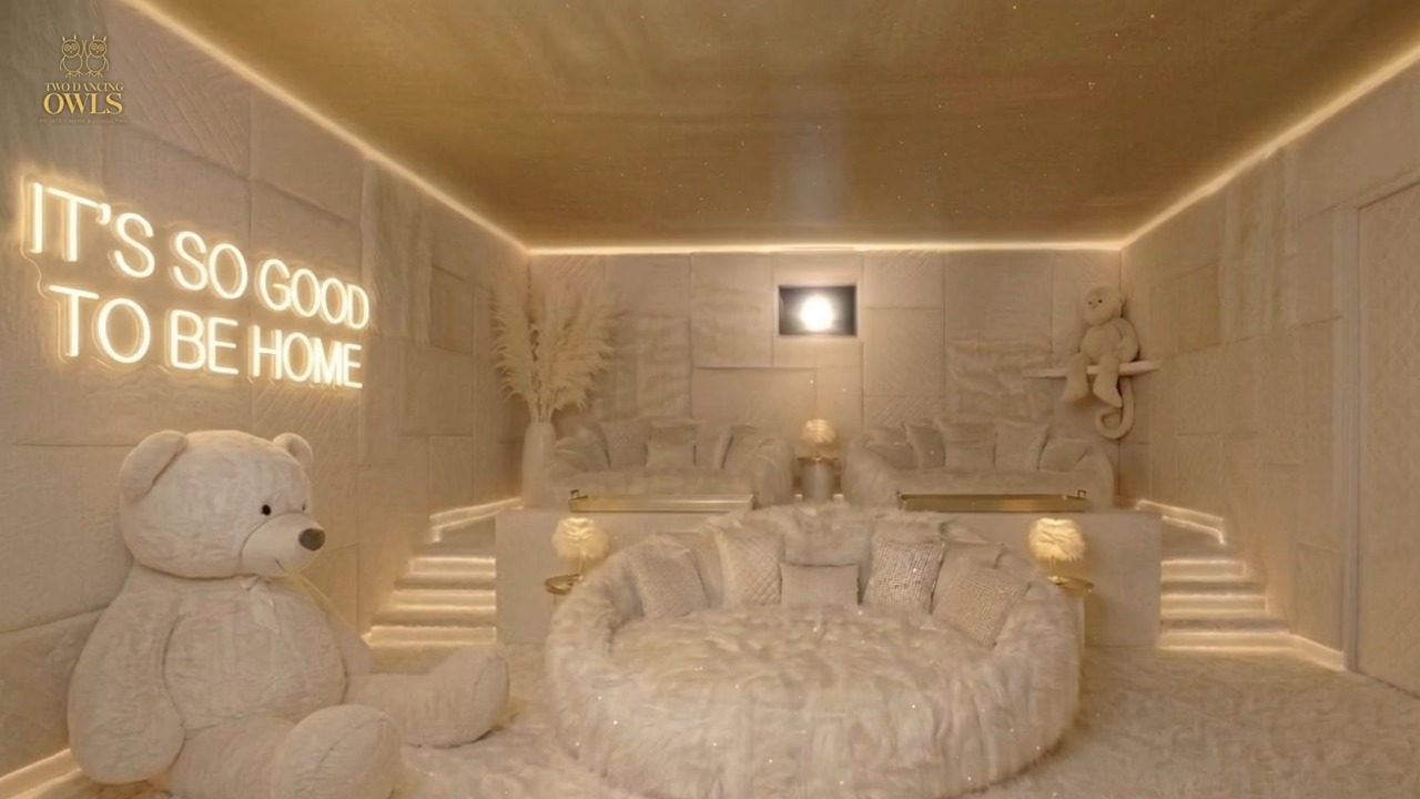 Side view of The Nest with the neon sign, the teddy bear and the stepped back row