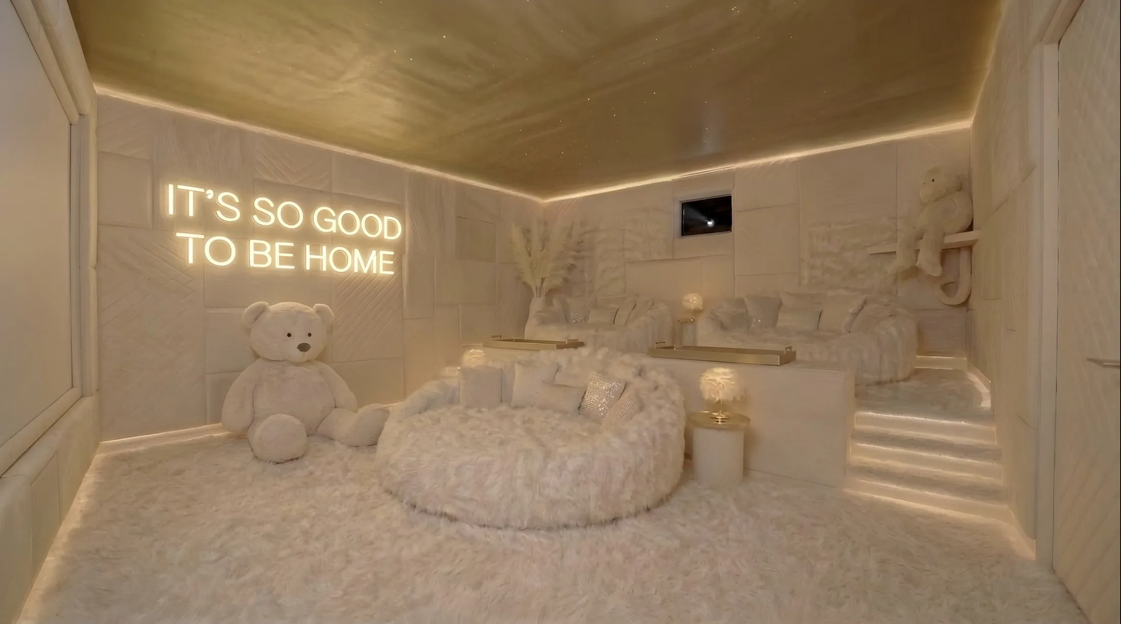 The Nest, a white private cinema with soft fur seating, a star ceiling and a teddy bear